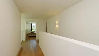 an empty room with white walls and wooden floors at Casa Bougainvillea by CleverDetails, private pool 