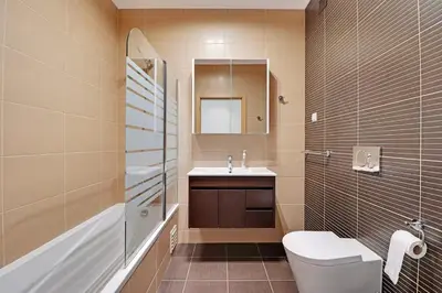 a bathroom with a toilet and a sink at Jardins da Marina by Albufeira Rental in Albufeira