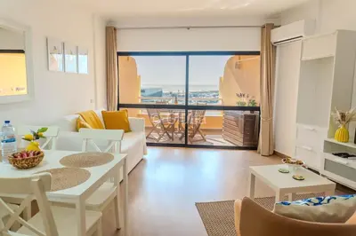 a living room with a couch and a table at Algarve Vilamoura Quarteira vue sur Ocean-Portugal in Quarteira