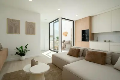 a living room with a couch and a table at Townhouse with Heated Pool in Downtown Faro in Faro