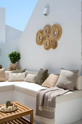 a white couch with pillows on it in a room at Townhouse with Heated Pool in Downtown Faro in Faro