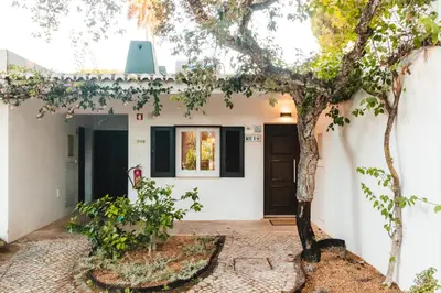 a house with a tree in front of it at Bonita V3 431, Health club, tenis, golf, no Balaia Golf Village in Olhos de Água