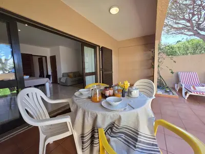 a table and chairs in a room with a table and chairsktop at Cimo do Monte Natur by SAPvillas in Vilamoura