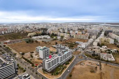 an aerial view of a city with tall buildings at HolidaysPT - Sunset At Lux Terrace - 2 Bedroom Apt in Faro