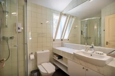 a bathroom with a sink and a toilet and a shower at Your villa in Vilamoura in Quarteira