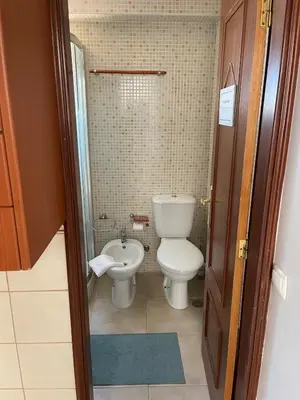 a small bathroom with a toilet and a bidet at Estúdio na Falésia 2 in Olhos de Água