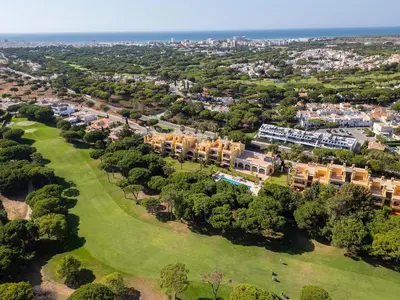 an aerial view of a resort with trees and buildings at Vila Sol F5 Vilamoura 2BR by Enjoy your stay in Quarteira
