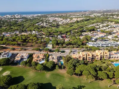 an aerial view of a residential neighbourhood with houses and trees at Vila Sol F5 Vilamoura 2BR by Enjoy your stay in Quarteira