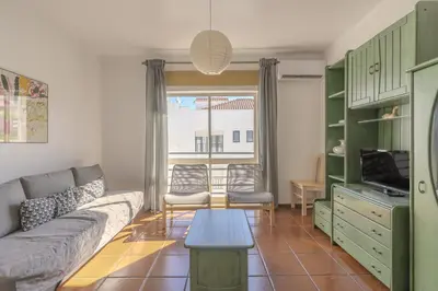 a living room with a couch and a table at #348 Apartment Madaleno by Home Holidays in Roja- Pé