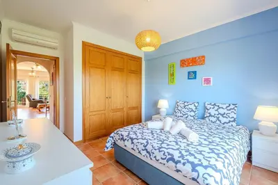 a living room with couches and a table at Bragança Paradise in Albufeira