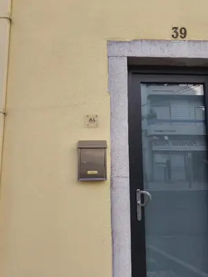 a door to a building with a mailbox on it at Studio 39 Downtown in Faro