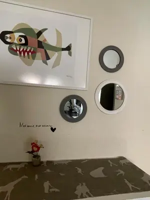 a bedroom with a fish decal on the wall at City Dreams in Faro
