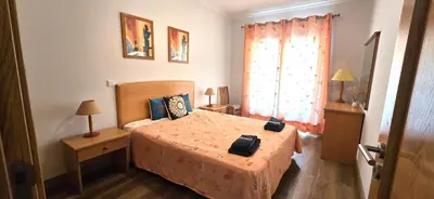 a small bedroom with a bed and a window at Ocean life in Albufeira