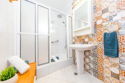 a bathroom with a sink and a shower at Villa Mare in Albufeira
