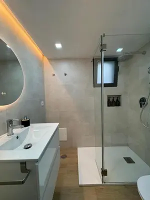 a bathroom with a sink and a shower at Refúgio junto à falésia in Olhos de Água