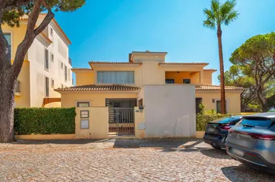 a house with a car parked in front of it at 3 Quartos, Piscina, AC, Garagem, Prestige For Home in Faro