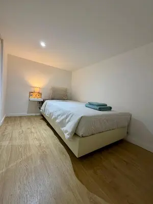 a bedroom with a large bed in a room at Albufeira Solmare Suites in Albufeira
