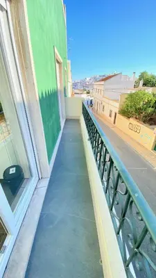 a balcony of a building with a view of a street at Albufeira Solmare Suites in Albufeira