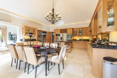 a kitchen with a dining room table and chairs at Villa Flow