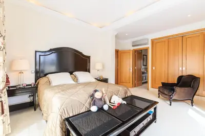 a bedroom with a bed and a desk and a chair at Villa Flow