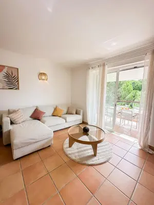 a living room with a couch and a table at Luxury Apartment in Vila Sol Resort in Quarteira
