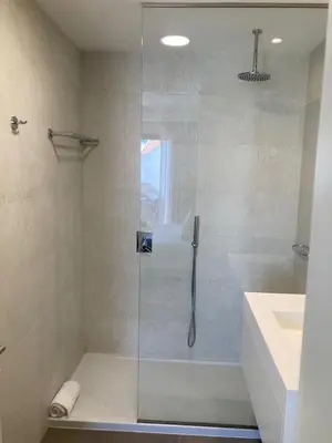a bathroom with a glass shower with a sink at Villa Soligolf - Vilamoura, Algarve in Quarteira