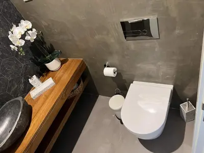 a bathroom with a white toilet and a sink at Villa Soligolf - Vilamoura, Algarve in Quarteira