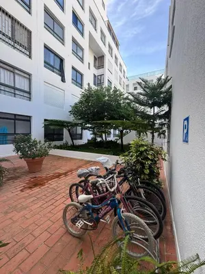 two bikes are parked next to a building at Beach House in Quarteira