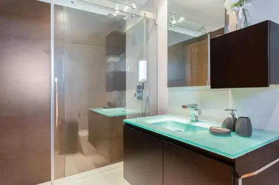 a bathroom with a glass shower and a sink at Snazzy Varandas do Castelo One Bedroom Apartment sleeps 2 persons in Albufeira