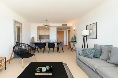 a living room with a couch and a table at Snazzy Varandas do Castelo - One Bedroom Apartment sleeps 2 person in Albufeira
