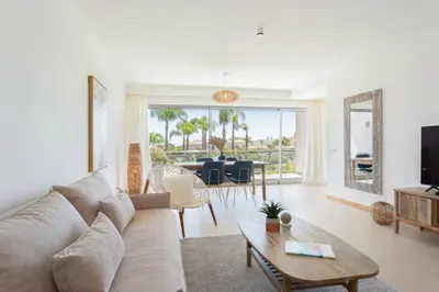a living room with a couch and a table at Snazzy Varandas do Castelo - One Bedroom Apartment sleeps 2 person in Albufeira