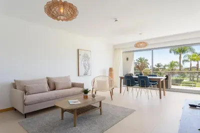 a living room with a couch and a table at Snazzy Varandas do Castelo One-Bedroom Apartment sleeps 2 person in Albufeira