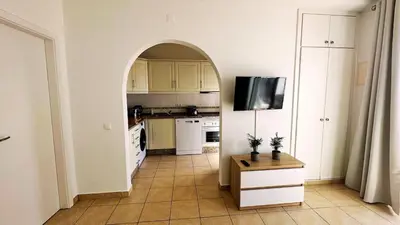 a small bedroom with a bed and a window at Villa With BBQ and Pool in Vilamoura in Quarteira