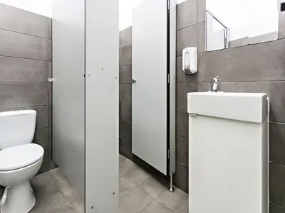 a bathroom with a toilet and a sink at Baixa Terrace Hostel in Faro