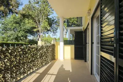 a walkway leading to a house with a fence at Mar e Golfe - Pool with golf view by HD in Vilamoura