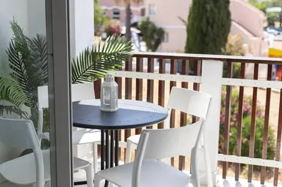 a blue table and chairs on a balcony at Marina Praia - Marina view by HD in Vilamoura