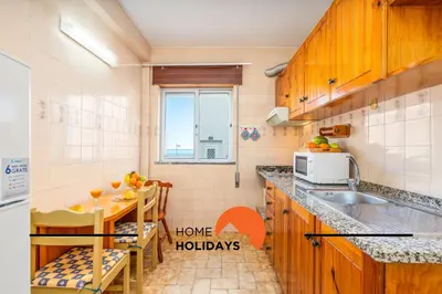 a small kitchen with a sink and a microwave at #352 Travessa do Mar Flats by Home Holidays in Albufeira