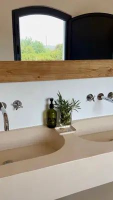 a bathroom sink with a bottle of soap on it at Casa Oliva do Sul in Almancil