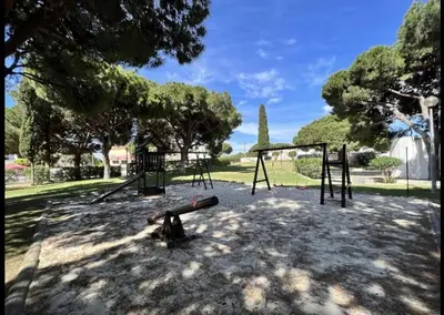 a park with a swing set and a playground at Studio Açoteias 410 in Albufeira