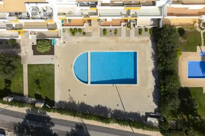 an overhead view of a swimming pool in a building at Vilamoura fresh by Hd in Vilamoura