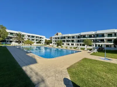 a large swimming pool in front of a building at Vilamoura Downtown by Homing in Vilamoura