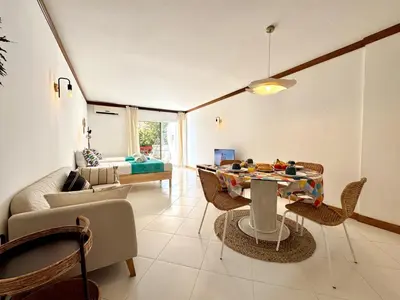 a living room with a table and chairs and a couch at Vilamoura Marina Beach With Pool by Homing in Vilamoura
