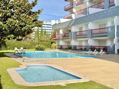 a swimming pool in front of a building at Vilamoura Marina Beach With Pool by Homing in Vilamoura