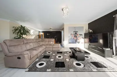 a living room with a couch and a tv at Villa Lando in Guia
