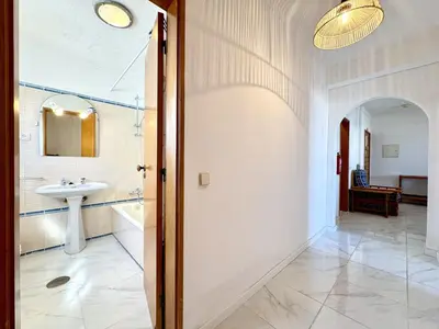 a bathroom with a sink and a mirror at Albufeira Vintage Apartment 2 With Pool by Homing in Albufeira