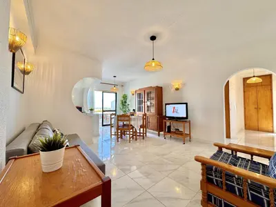 a living room with a couch and a table at Albufeira Vintage Apartment 2 With Pool by Homing in Albufeira