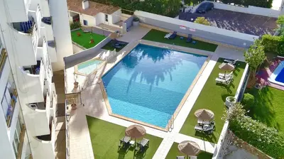 an overhead view of a swimming pool in a building at Albufeira Vintage Apartment 2 With Pool by Homing in Albufeira