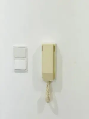 a phone on a wall in a room at Blue Apartament in Albufeira
