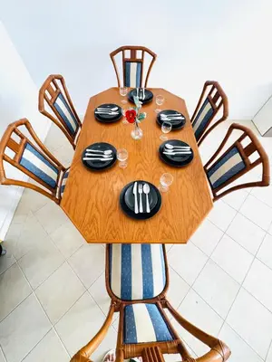 a wooden table with chairs and a tableasteryasteryasteryasteryasteryasteryasteryastery at Blue Apartament in Albufeira