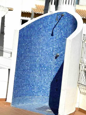 a blue tile wall on the side of a building at Apartamento 5 estrelas praia da oura in Albufeira